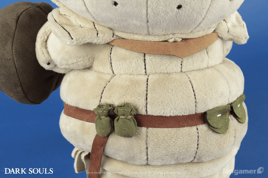 A closeup of the back of the Siegmeyer plush, showing a number of plush pockets and sacks attached to its belt as well as the back of its armor.  - Siegmeyer Plush - DARK SOULS