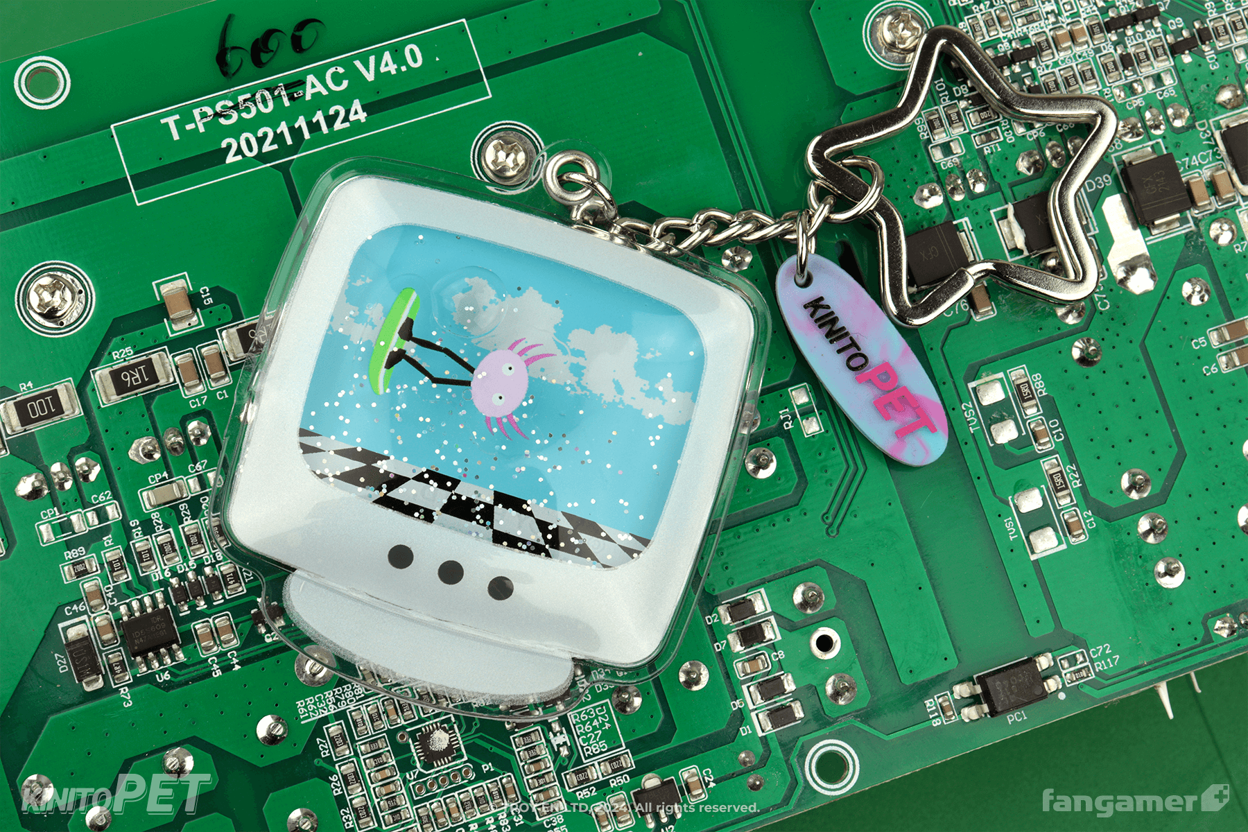 A black shirt with a cartoon representation of a computer window (titled Web Browser) showing The Kinito Crew in a living room environment with pink, green, and purple print colors. Something appears to be bleeding on the rug. "The Kinito Crew" is written in a naive, bubbly style. 