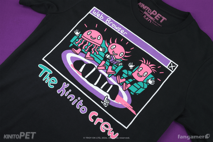 A black shirt with a cartoon representation of a computer window (titled Web Browser) showing The Kinito Crew in a living room environment with pink, green, and purple print colors. Something appears to be bleeding on the rug. 